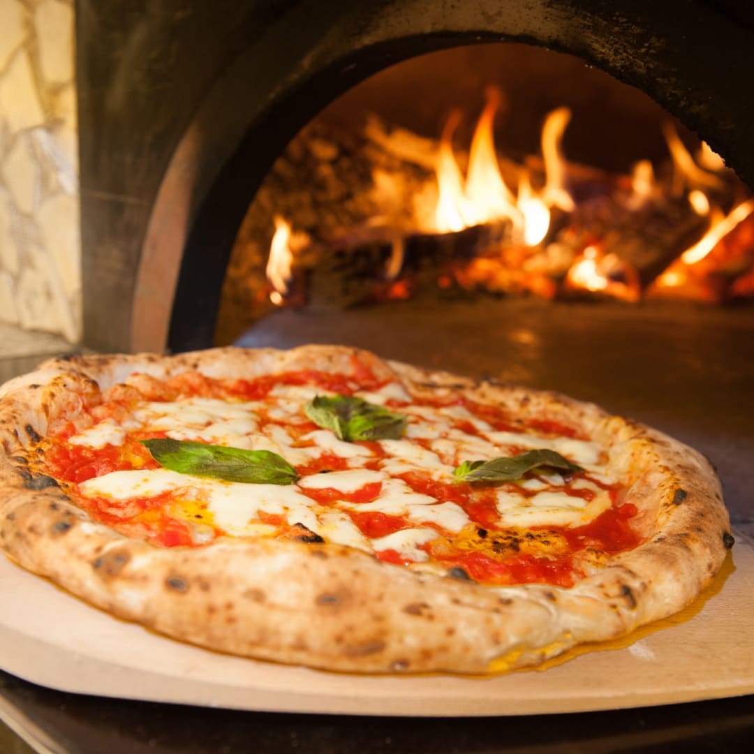 Hand-tossed pizza fresh from the oven at Gino’s Pizza, Pasta & Co. in Federal Way