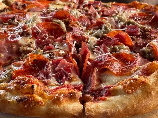 Hand-tossed pizza at Gino’s Pizza, Pasta & Co. in Federal Way