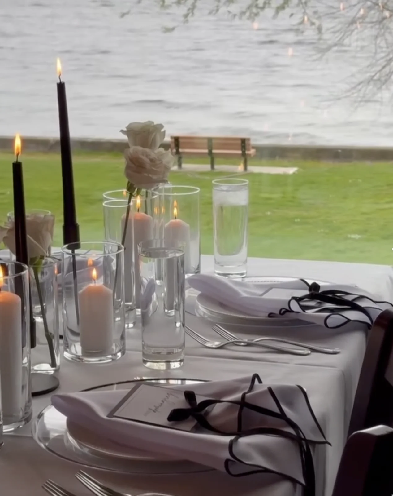 Waterfront table set with candles at Gino’s at the Point