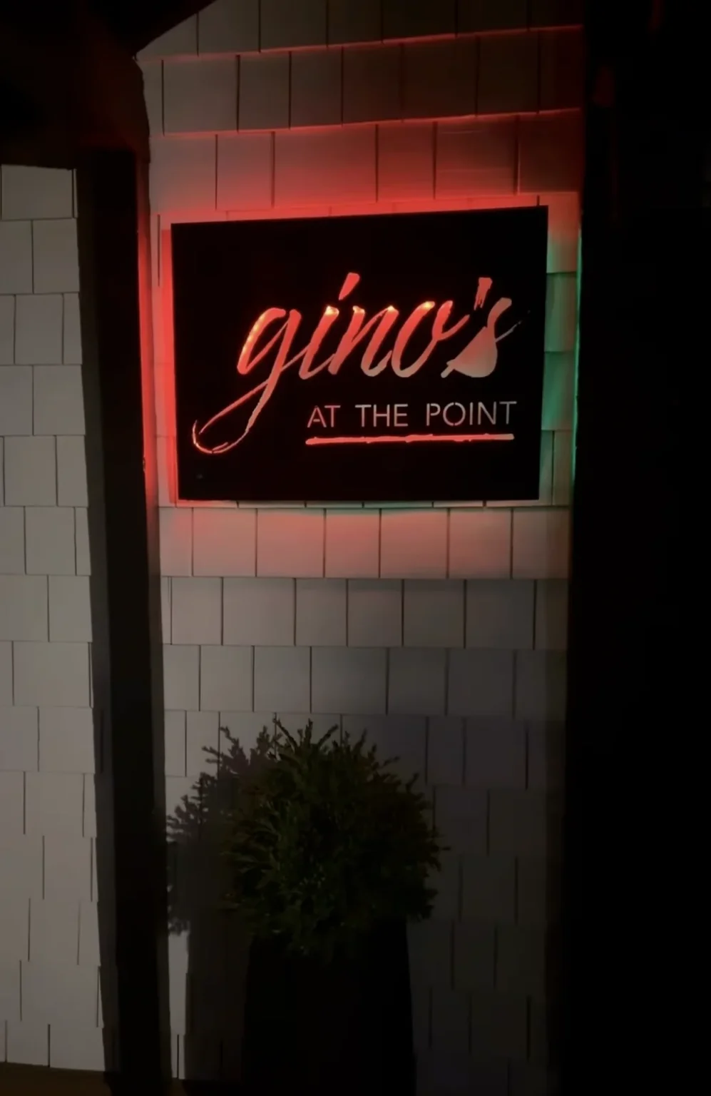 Gino’s at the Point illuminated sign at night
