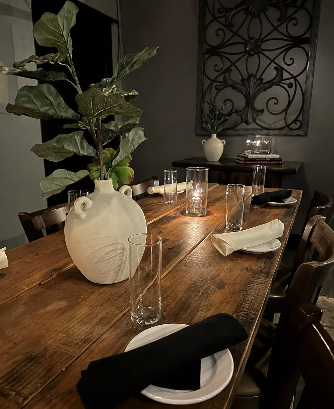 Private dining table set with candles at Gino’s